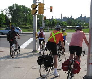 Bike commuters at a red light