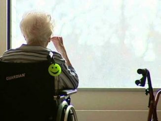 elderly patient looking outside window at long term car facility captured by GTA weekly Toronto news