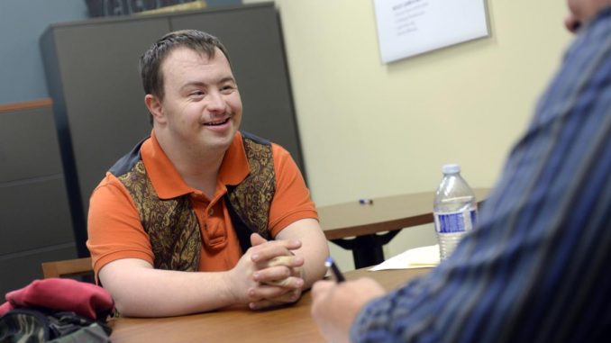 person with a disability discussing their employment opportunities with gta weekly Toronto News