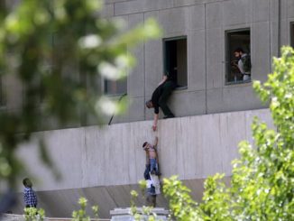 Policeman helping a child out of a building window during terrorist attack