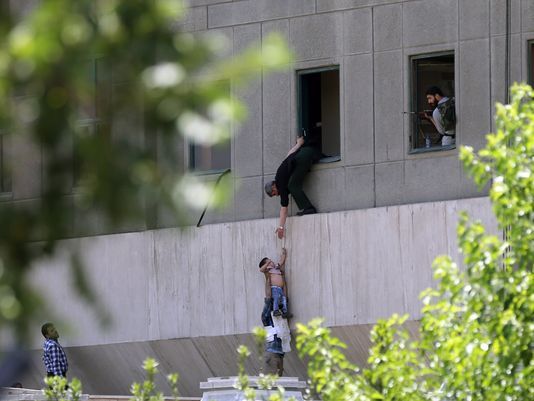 policeman-civilians-fleeing-building-terrorist-attack