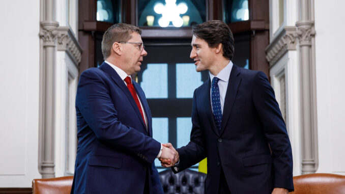 Prime Minister Justin Trudeau speaks with Saskatchewan Premier Scott Moe